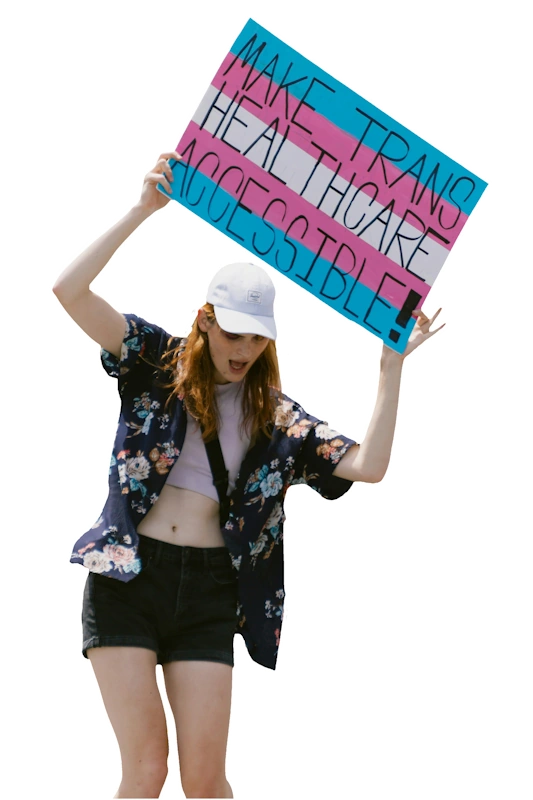 Woman holding sign saying 'Make Trans Healthcare Accessible'